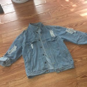 Distressed blue jean jacket